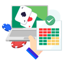 Laptop showing a blackjack game with casino symbols, and a hand holding an approved cheat sheet with different coloured squares