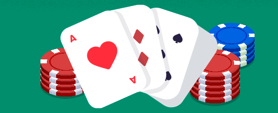 Playing cards between casino chips