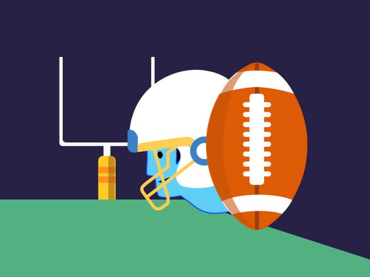 A football player with ball running toward the goal lines