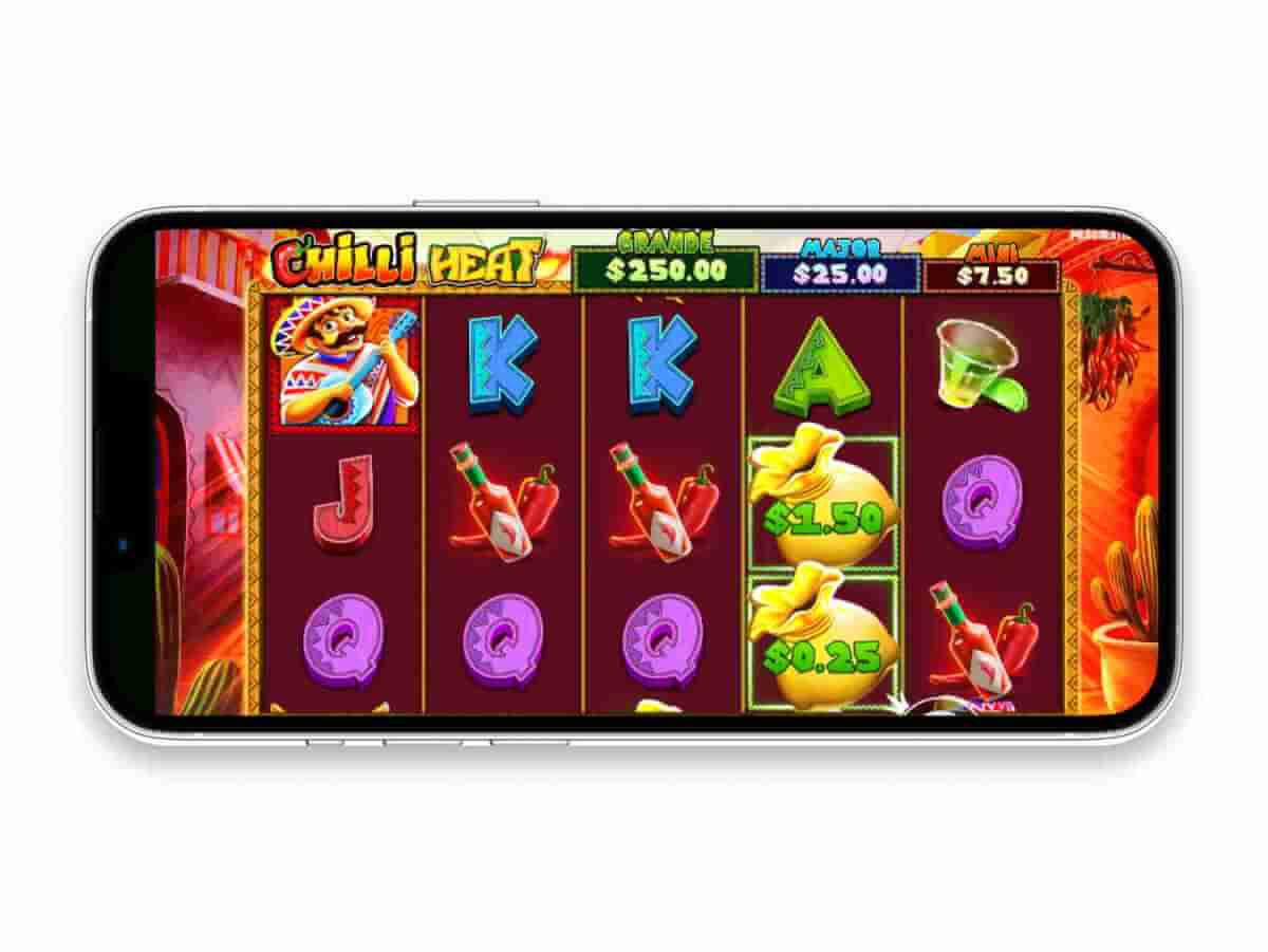 Chilli Heat base game reels against Mexican-themed background, displaying Mariachi and Money Bag symbols.